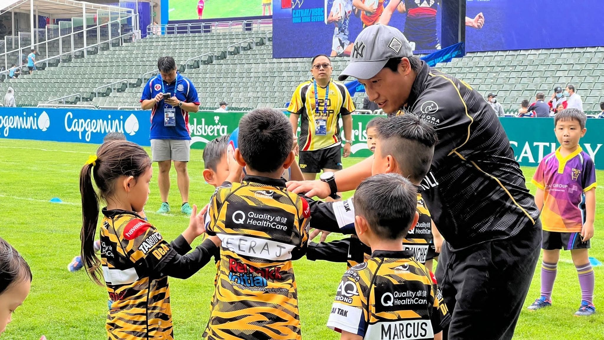 USRC Tigers parent-coach leading a safe tackle drill